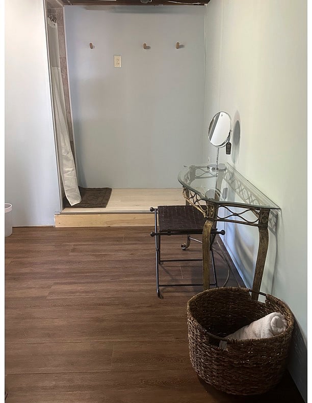 Large bathroom with shower stall, mirror and vanity