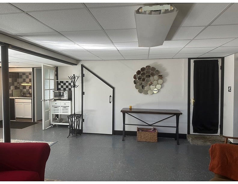 Living space with full size kitchen sink.