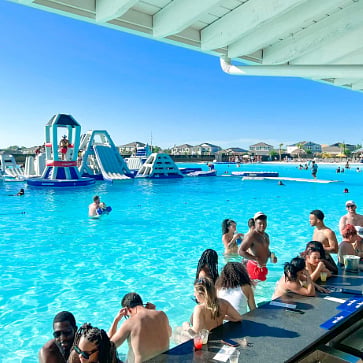 Water activities like an obstacle course, paddleboarding, & kayaking - community lagoon