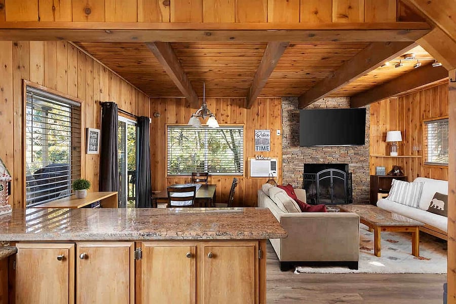 Open concept living space with plenty of seating for meals at the bar and the dining table