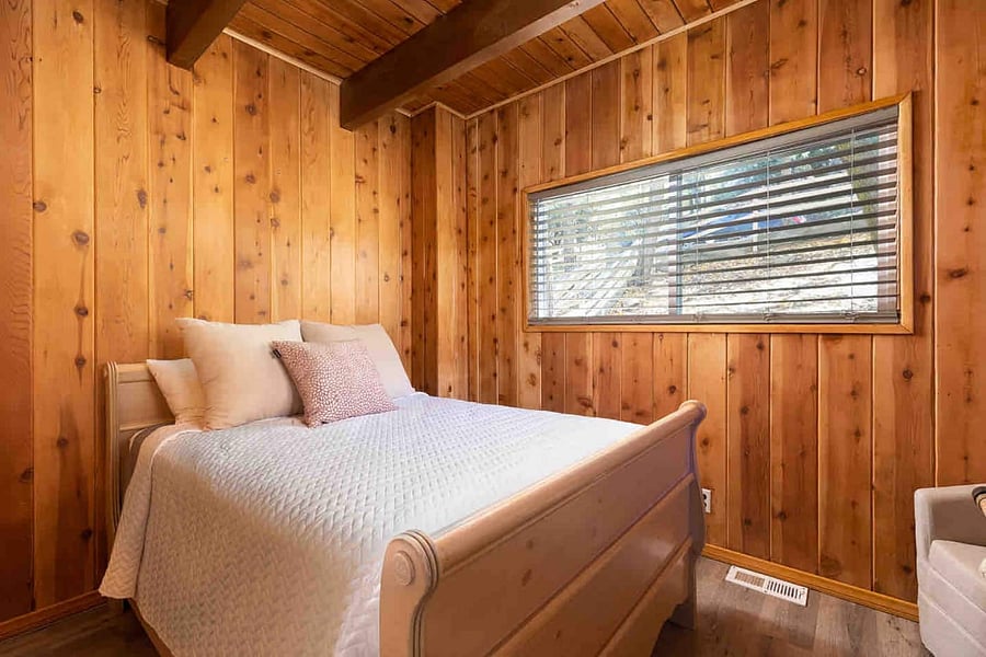 This guest room is on the main level - theres a desk in this room as well (shown in another photo) with the bathroom across the hall