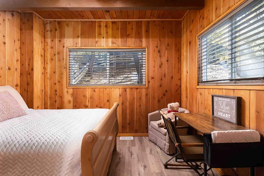 Main level guest bedroom with workspace for working remote or taking online classes