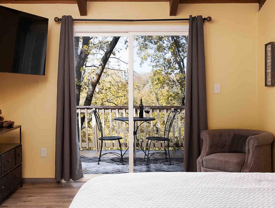 Primary bedroom on the 2nd level upstairs with private balcony