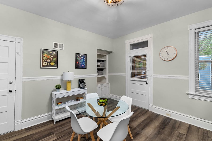 Interior door leads to private staircase for backyard access. Exterior door leads to balcony overlooking the back yard.