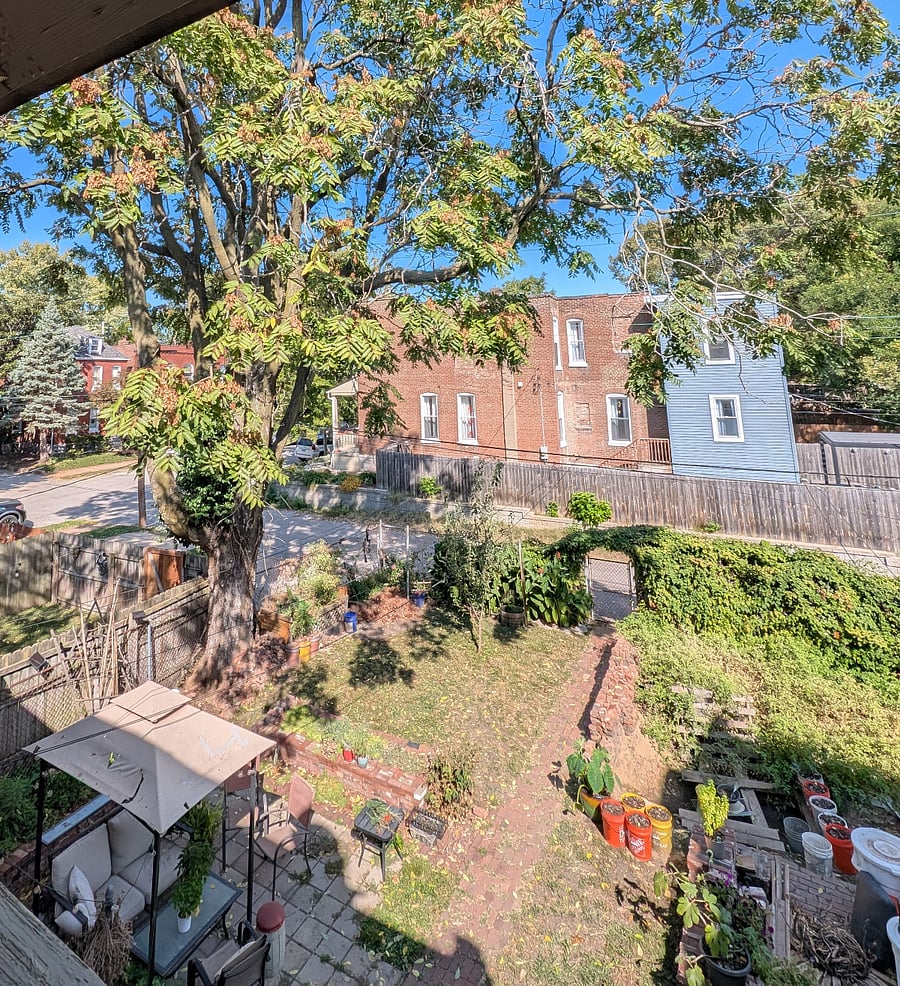 View of yard from 2nd floor apartment balcony