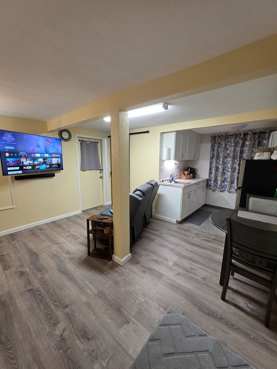 Living area looking at dining table and kitchen