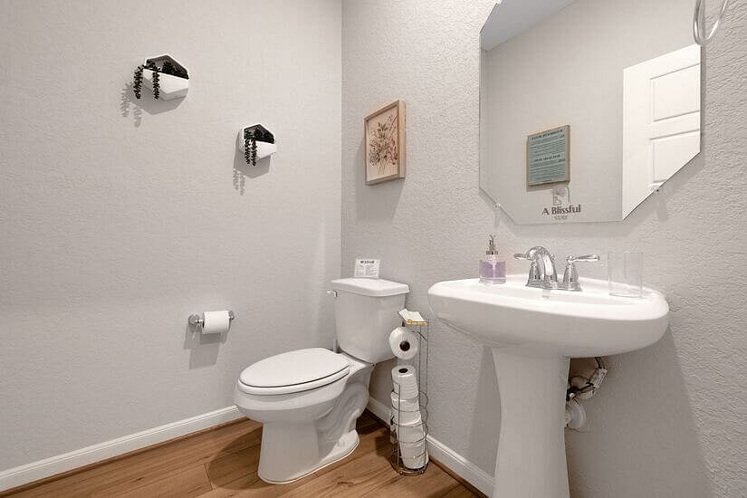 Shared half bath between office and formal dinning room on first floor.