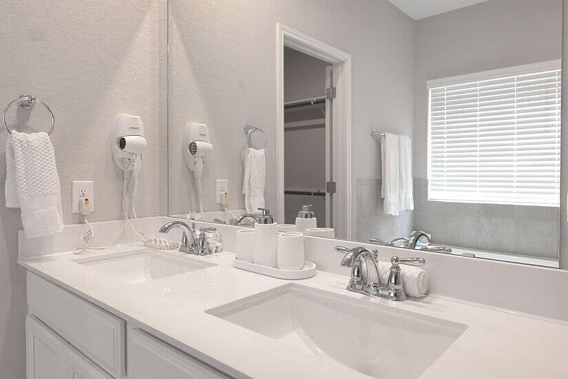 Wall-mounted hair dryers in 3 full bathrooms.