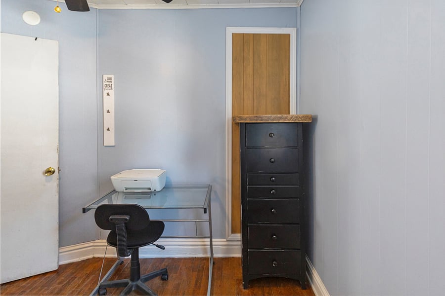 Bedroom with twin bed and work station