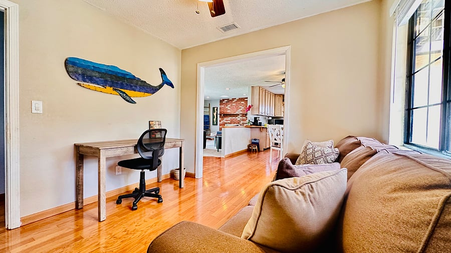 Quiet space with couch and dedicated laptop desk for remote work