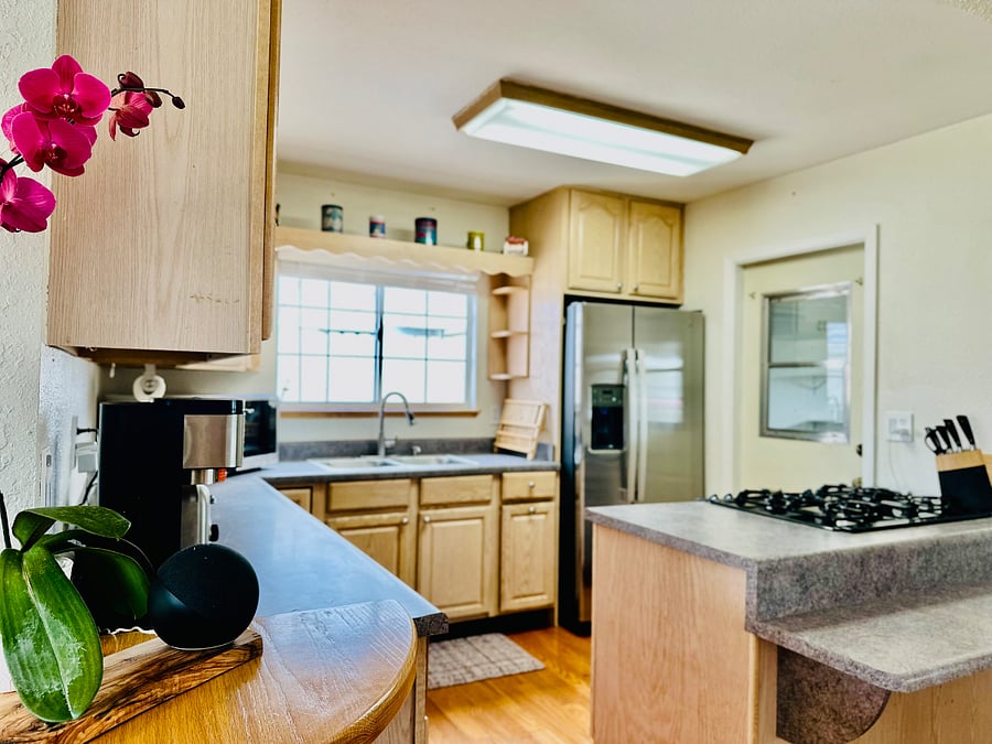 Full kitchen with brand new appliances opens up into the dining area and living room for a lovely great room feel.