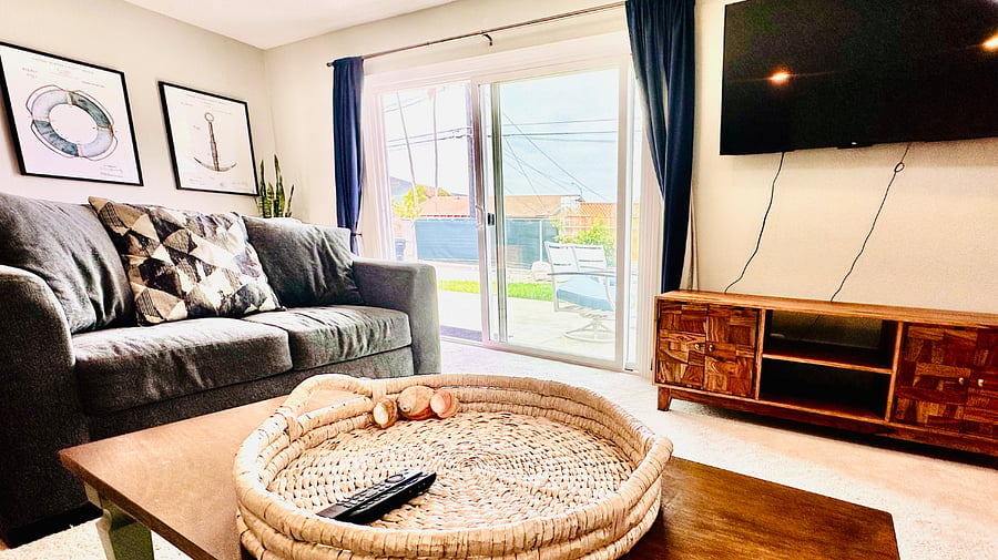 Large TV with streaming services in the living room and each bedroom, including Netflix, Disney+, Hulu, and Paramount+