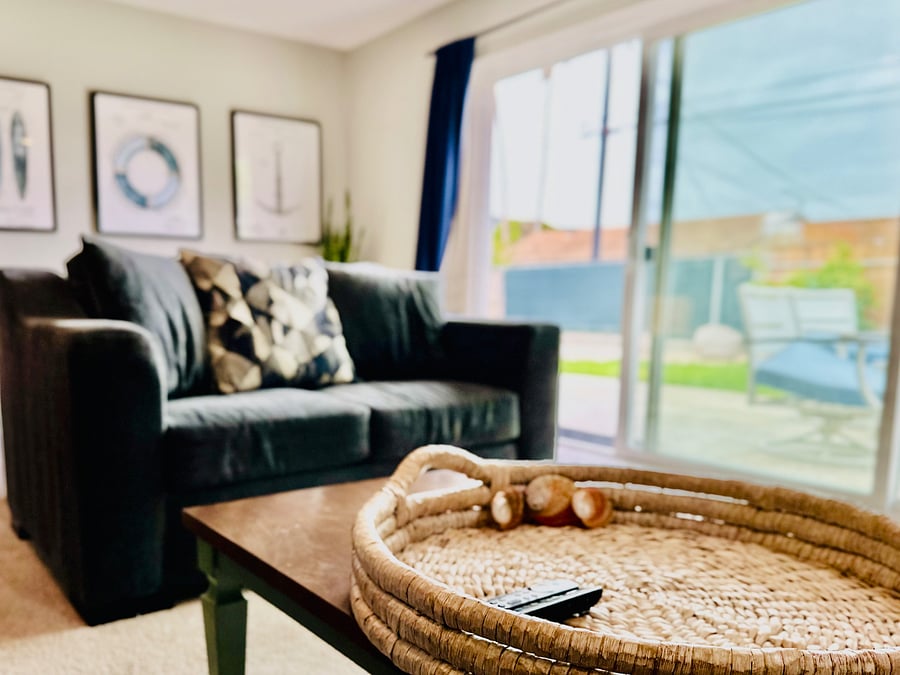 Large TV with streaming services in the living room and each bedroom, including Netflix, Disney+, Hulu, and Paramount+