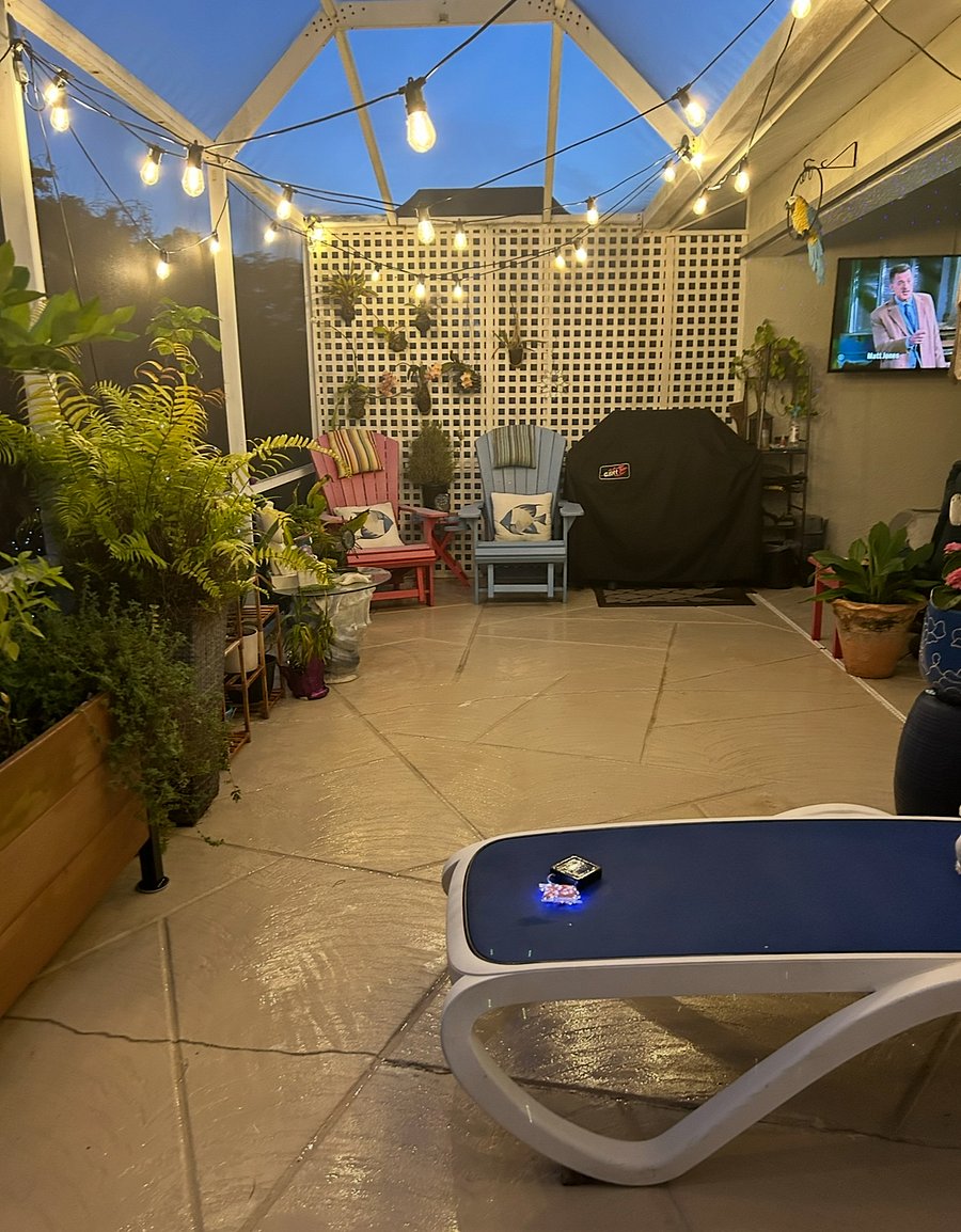 Screened patio with gas grill and TV