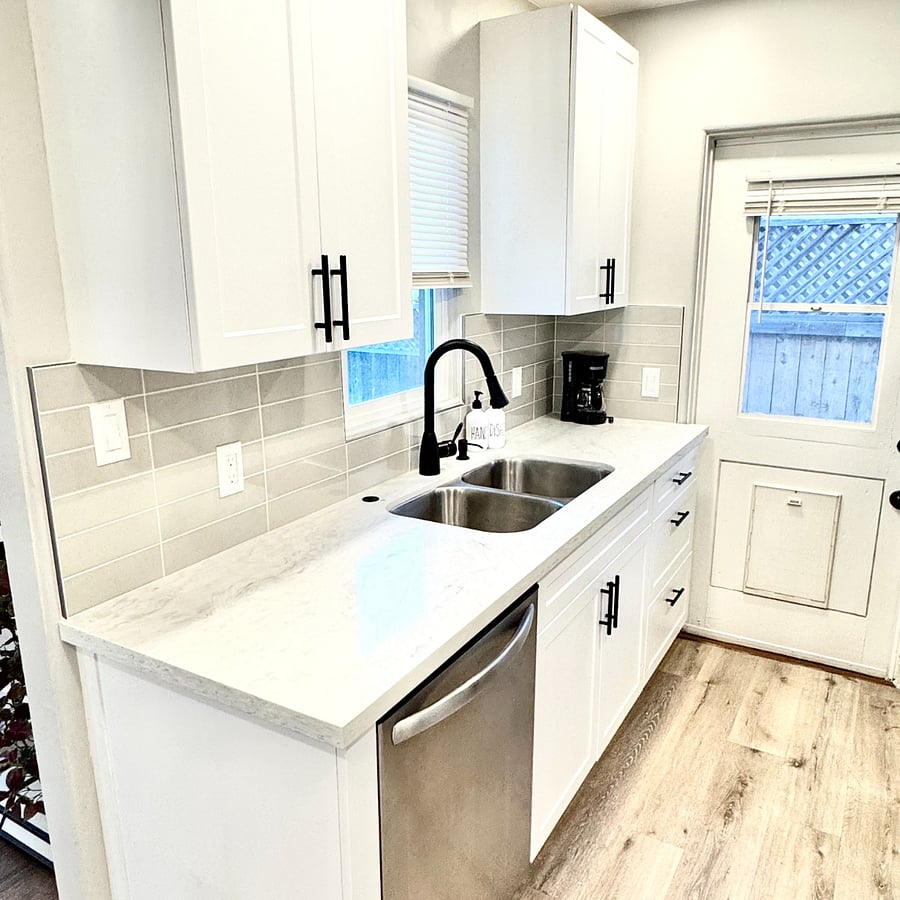 Kitchen View with Sink and Dishwasher. Exterior Backyard Access