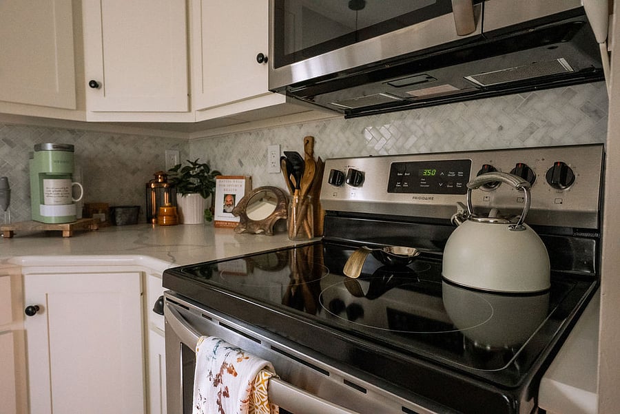 glass cooktop stove and spacious quartz countertop