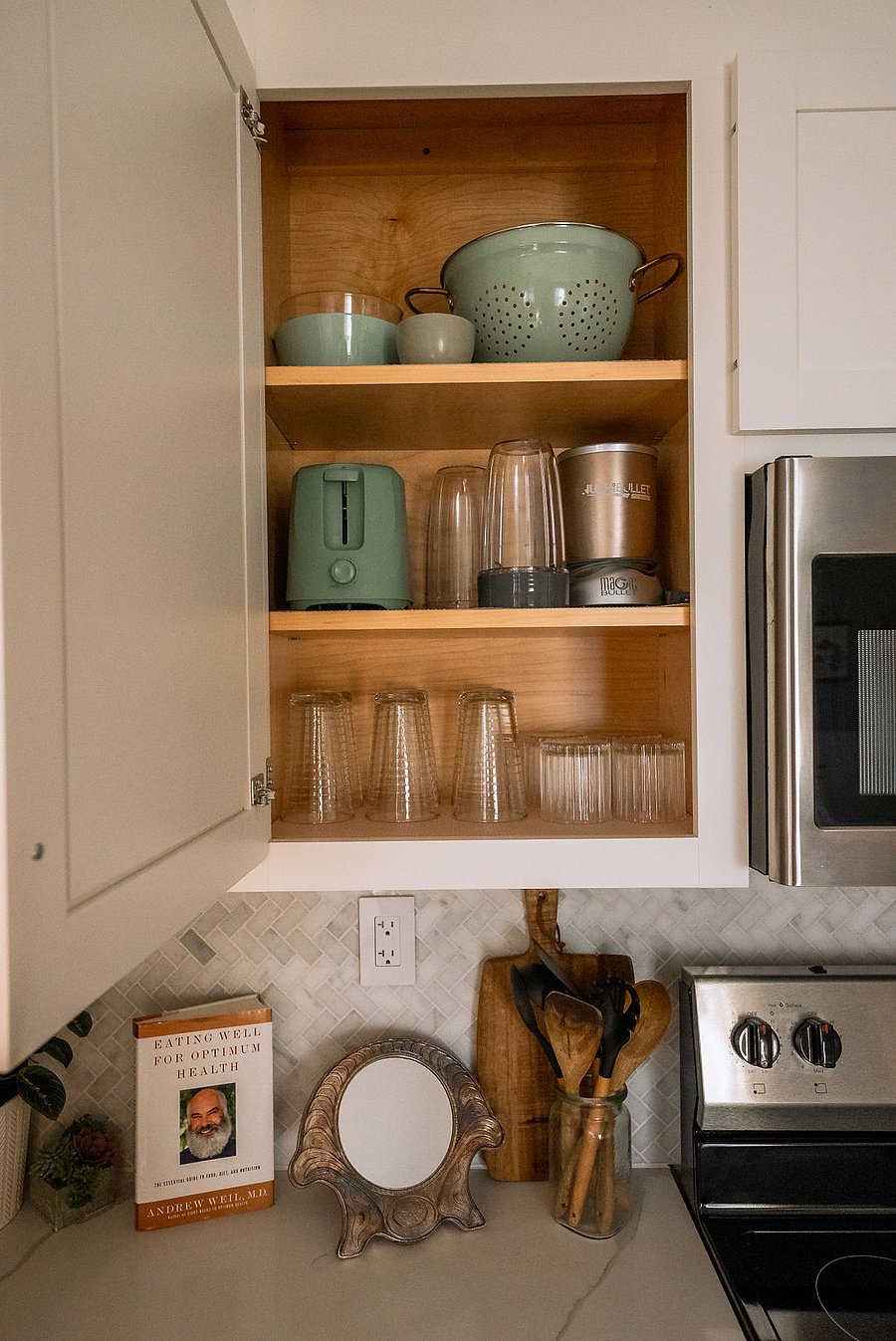 custom cabinets stocked with glassware and appliances