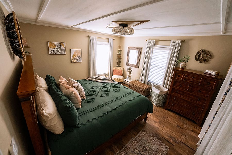 master bedroom with king-size memory foam mattress, blackout curtains, and spacious closet