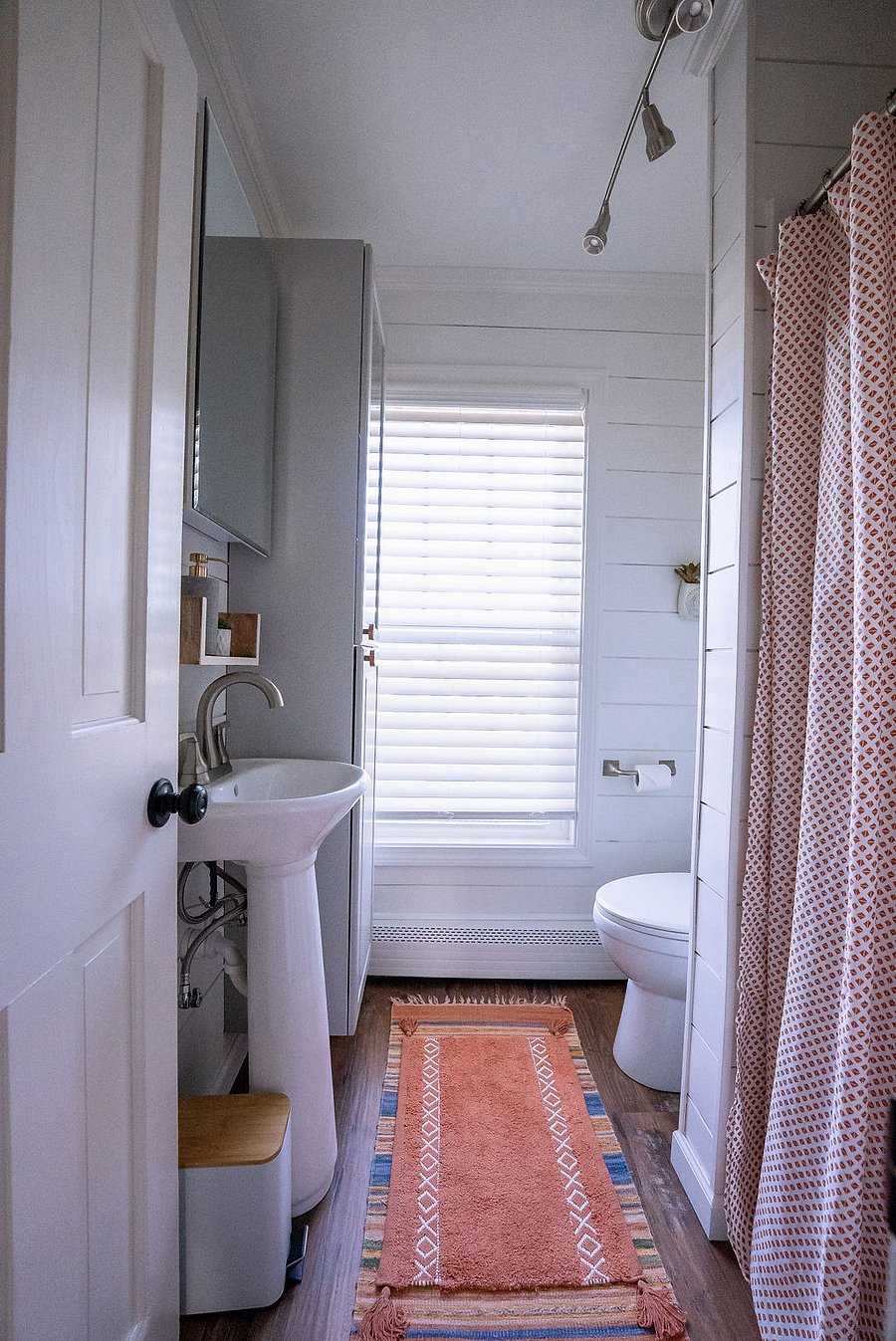 well-lit and fully-stocked bathroom