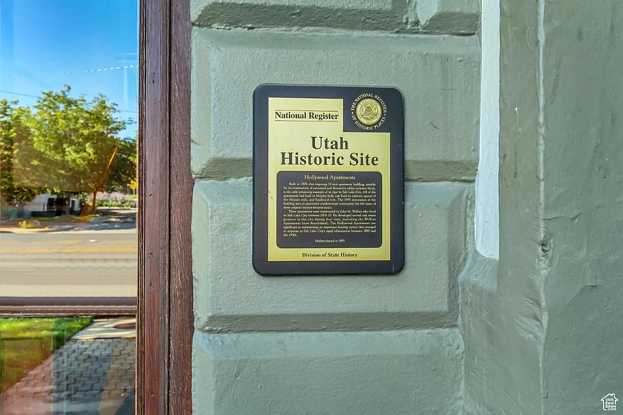 Plaque designating the Hollywood Apartments as a Utah Historic Site on the National Register.