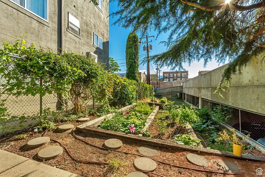 Raised-bed community garden with stepping-stone path.