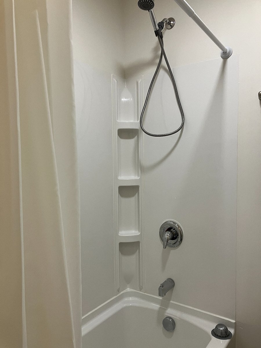 Shower with handheld sprayer