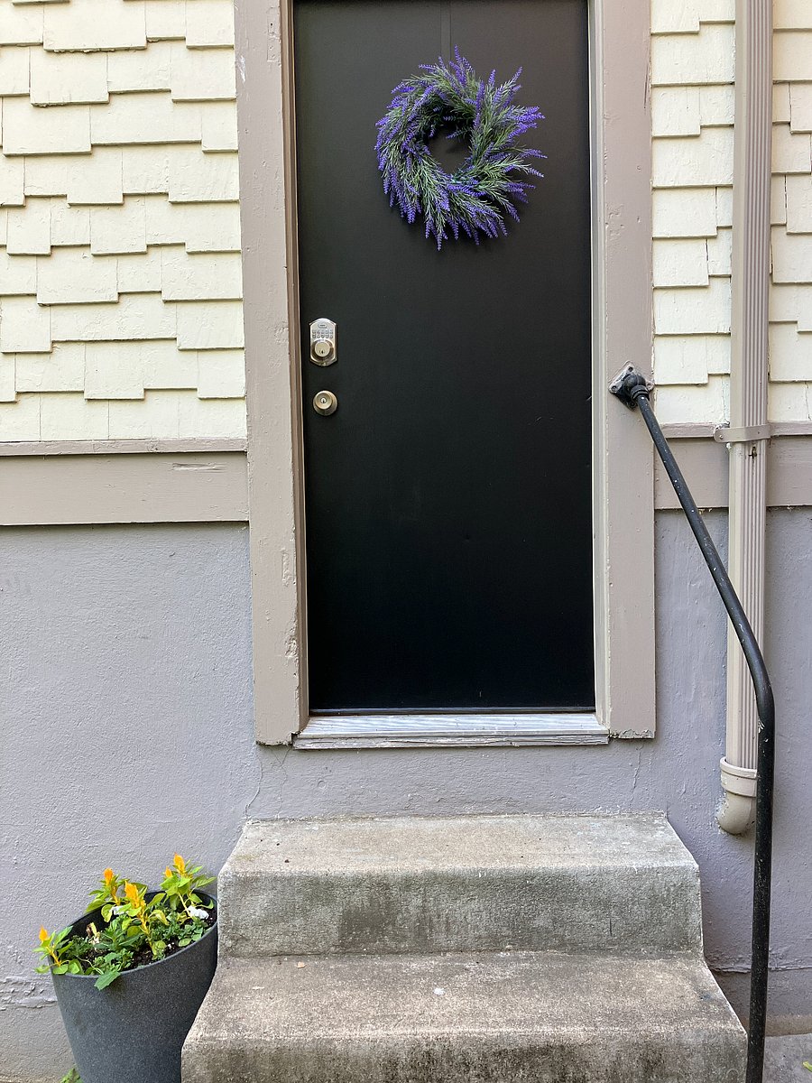 Private entrance with a code just for you. A solar lamp is right above the door.