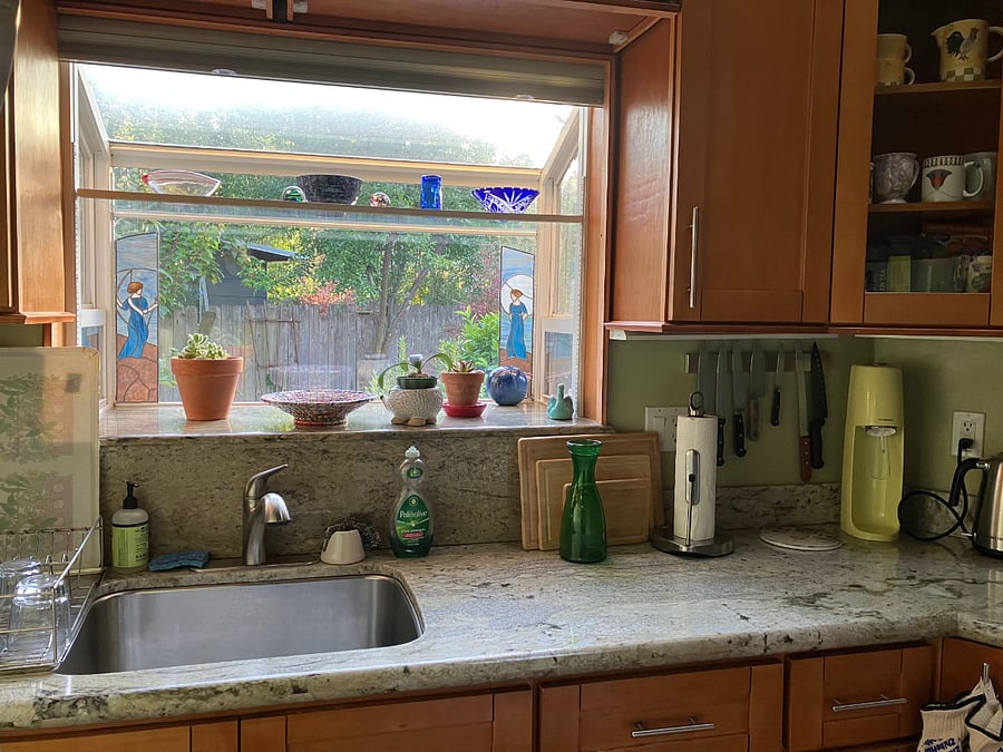 Interior kitchen, granite countertops, box window overlooking garden