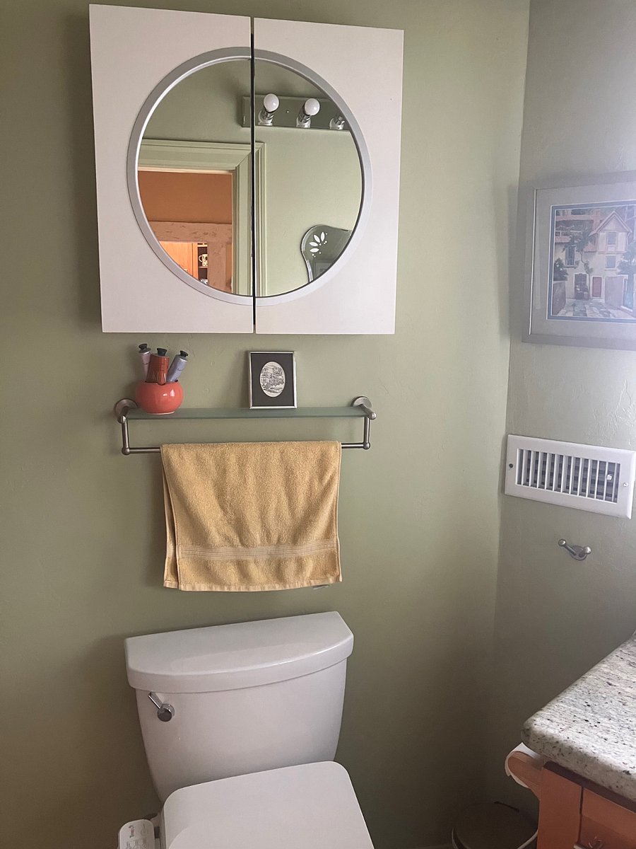 Cabinet is empty with containers for storage and also there is room in bathroom vanity.