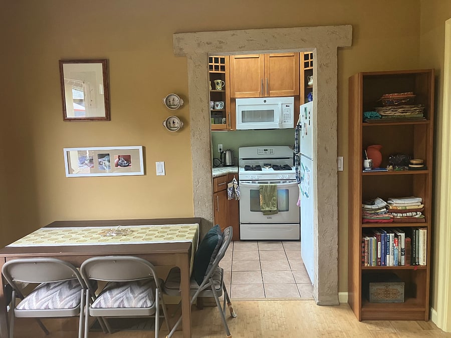 Table pulls out easily to accommodate more seating, extra chairs in unit