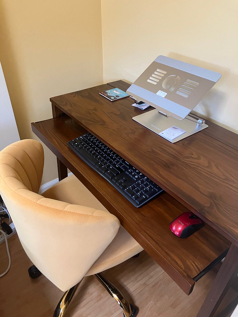 Desk alcove with external keyboard, mouse, adjustable laptop riser and printer. Chair is comfortable and adjustable