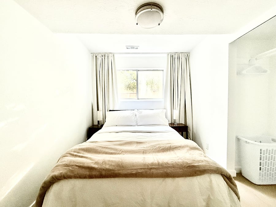 Bedroom 3: Full size bed, closet, and dedicated workspace.