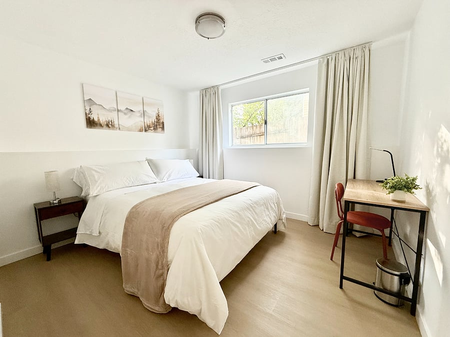 Bedroom 2: Queen size bed, closet, and dedicated workspace.