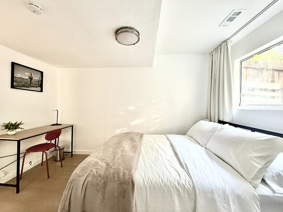 Bedroom 3: Full size bed, closet, and dedicated workspace.