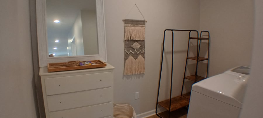 Large Laundry Room doubles as closet area.