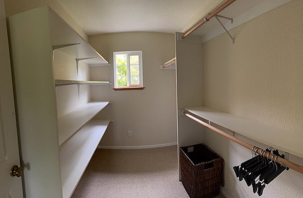 Large walk-in closet with storage shelves