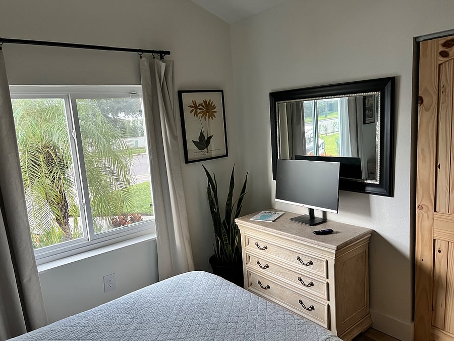 Cozy 2nd bedroom has a large picture window, yet stays cool. 