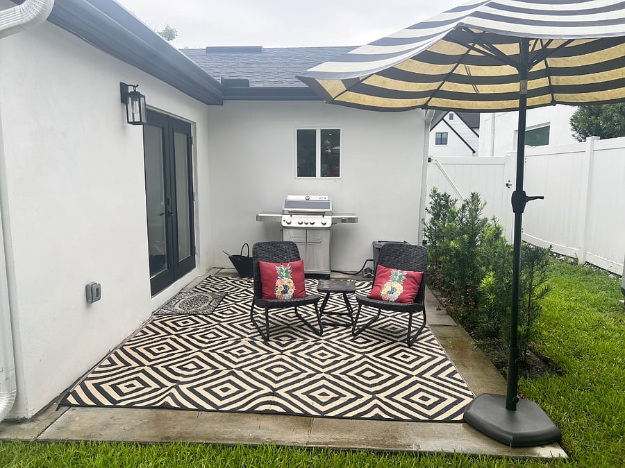 Enjoy chilling on the back patio and take in the greenery. 