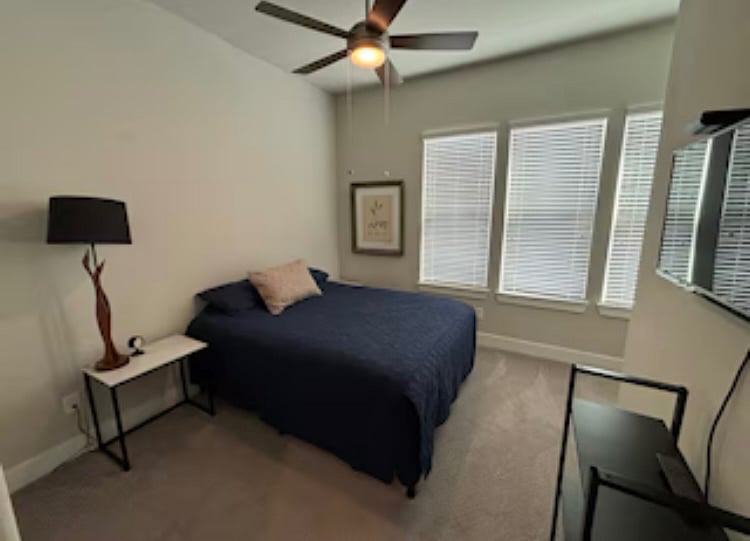 Queen sized bed, small tv with cable, large closet