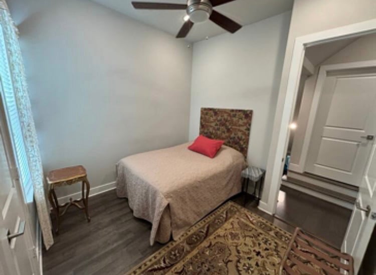 Bedroom #3 has a double bed, closet, and powerful ceiling fan.
