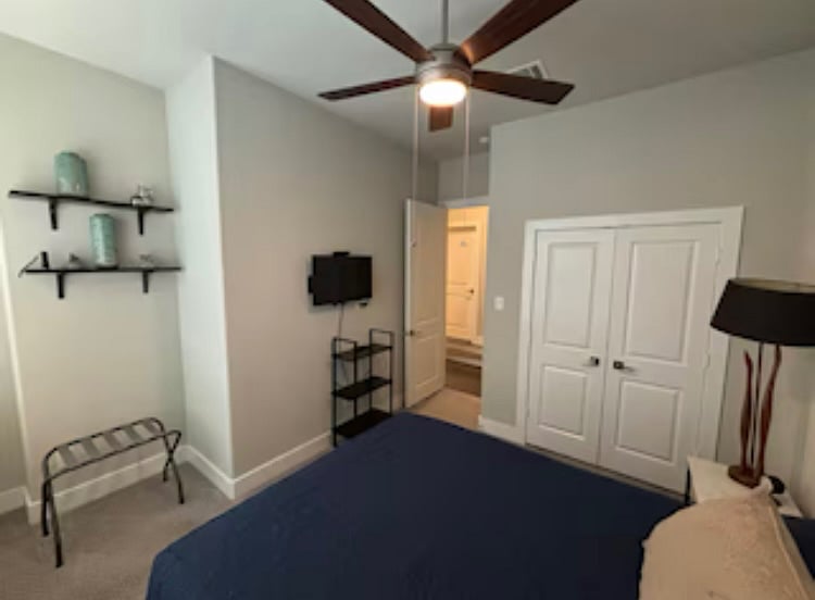 Bedroom #2 has a queen bed, large closet, and small tv with basic cable