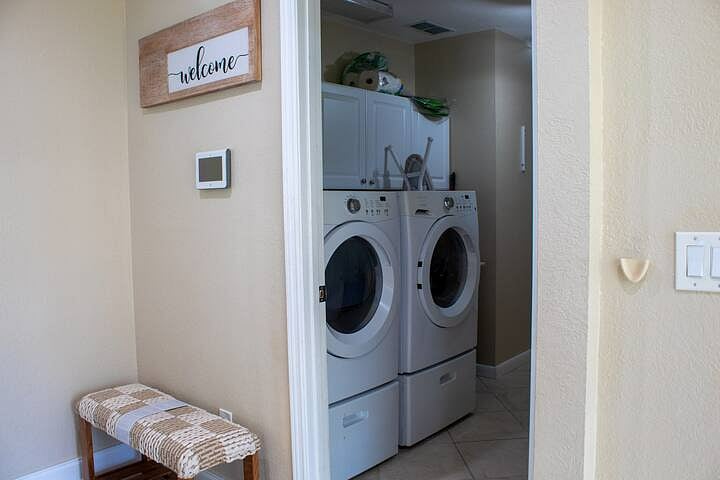 Entrance, alarm panel, Laundry Room.