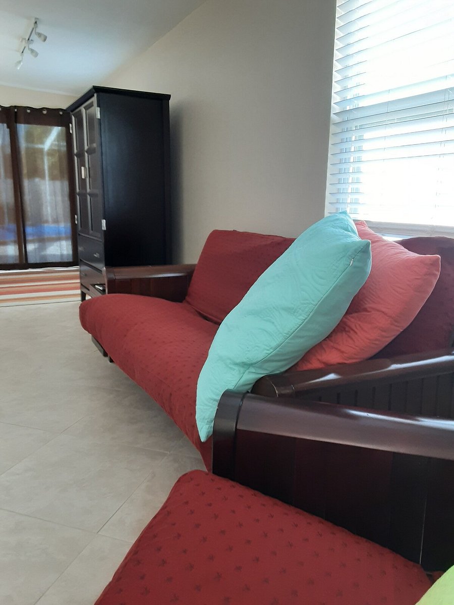 bedroom 4 has a smart tv and a pull out futon bed and chair.