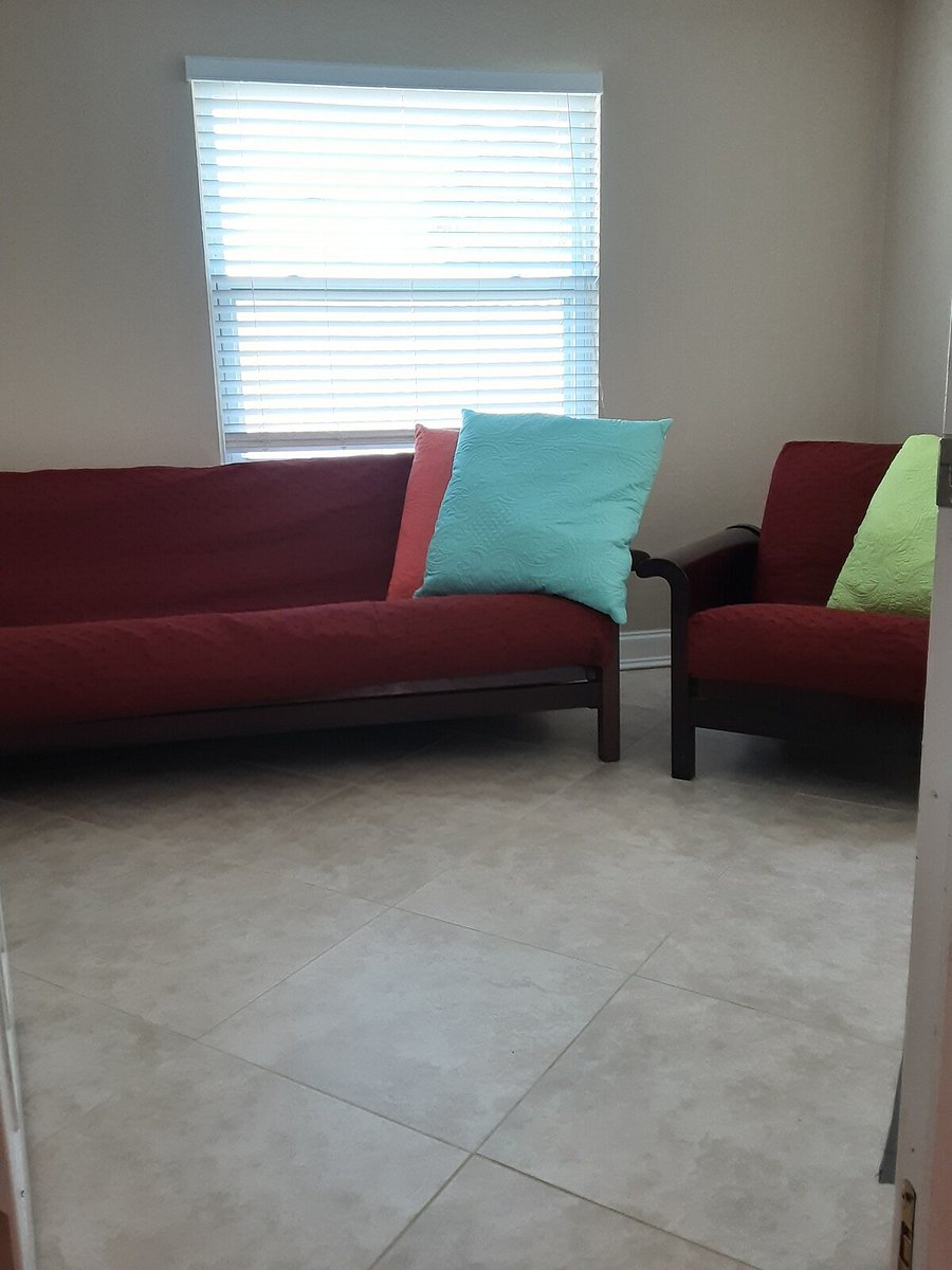 bedroom 4 has a smart tv and a pull out futon bed and chair.