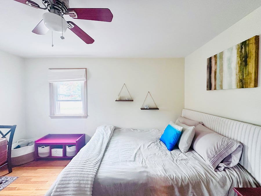 Cozy master bedroom with pops of color. 