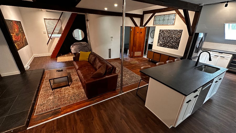Open plan lounge, with large kitchen island seating.