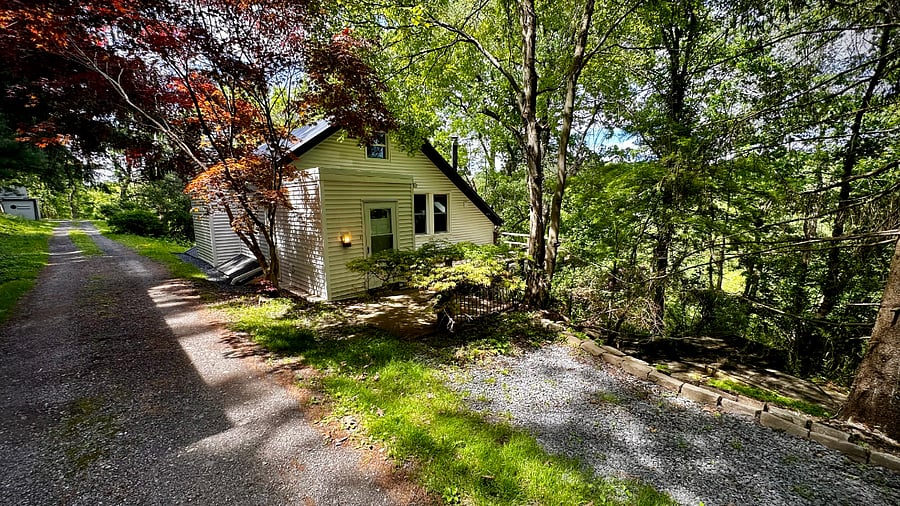 Up a private driveway, parking is available outside the cottage.
