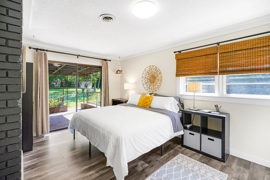 Master Bedroom with king sized bed, ensuite bath, closet and armoire.