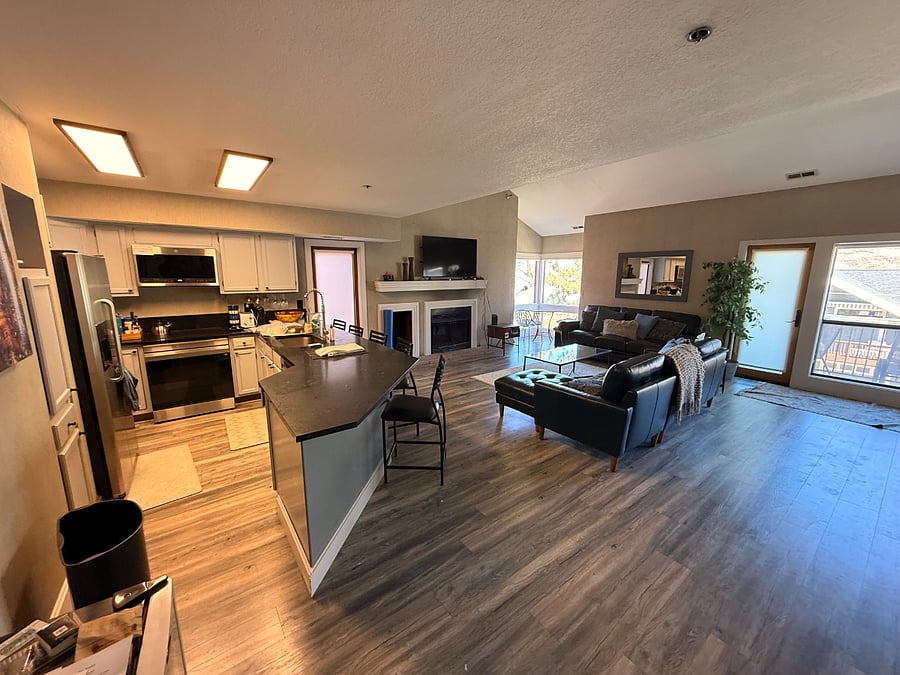 Open living room and kitchen. New greater counters and stainless appliances