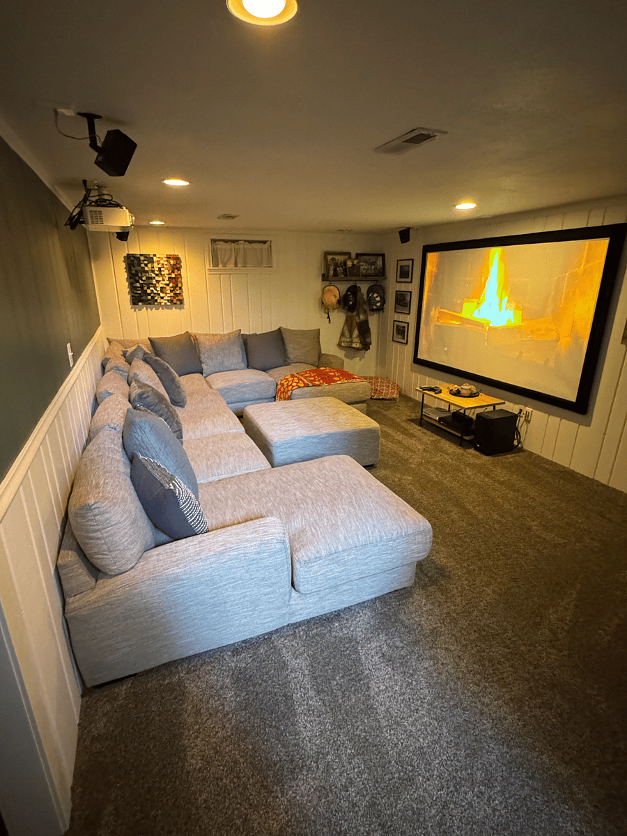 Downstairs projector and surround sound. There will be a different couch down here.